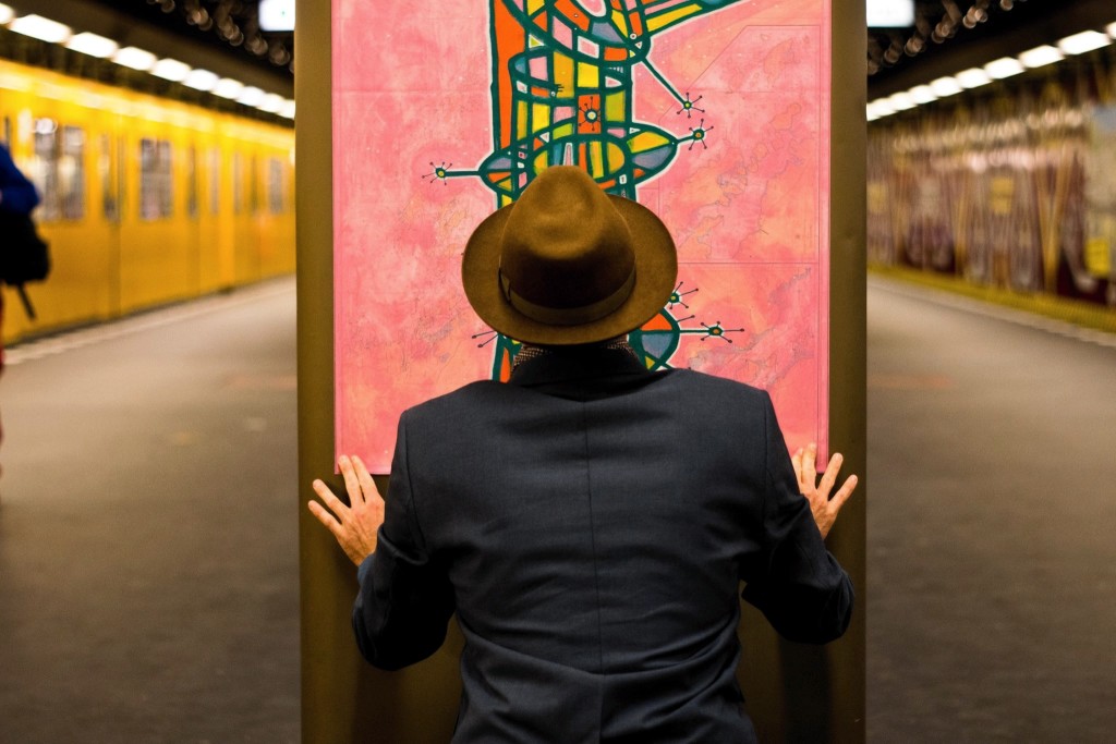 John putting up his artwork in Berlin's subway for a public exhibition.